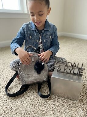 Kendall & Kylie Kids Metallic Silver Mini Backpack with Black Pom